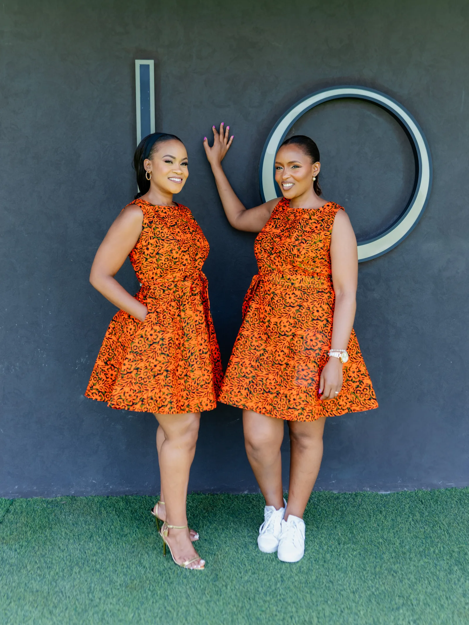 Phoenix, orange and black floral print sleeveless shift dress with tie waist